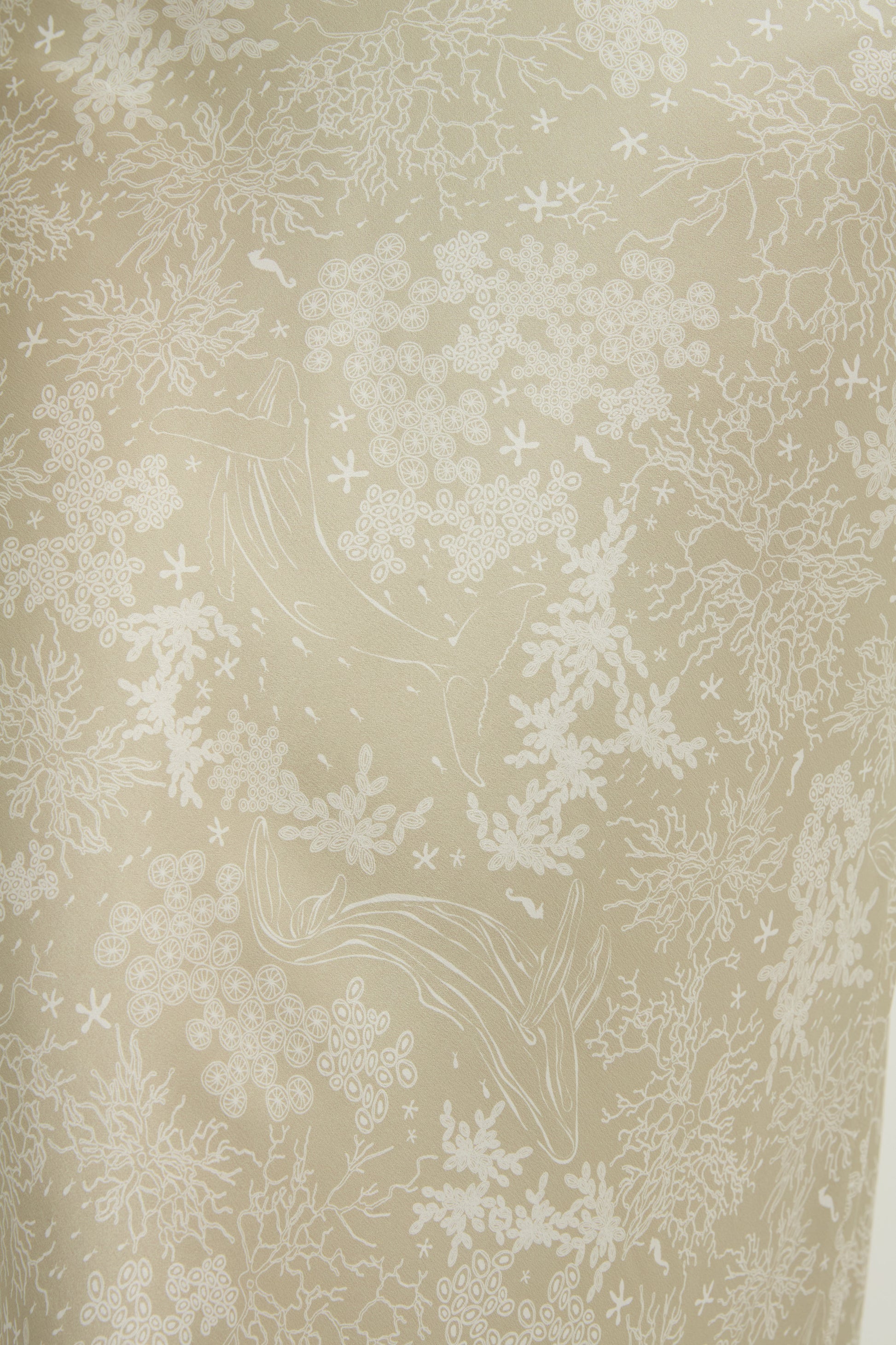 Beige and white coral print featuring sea life on silk.