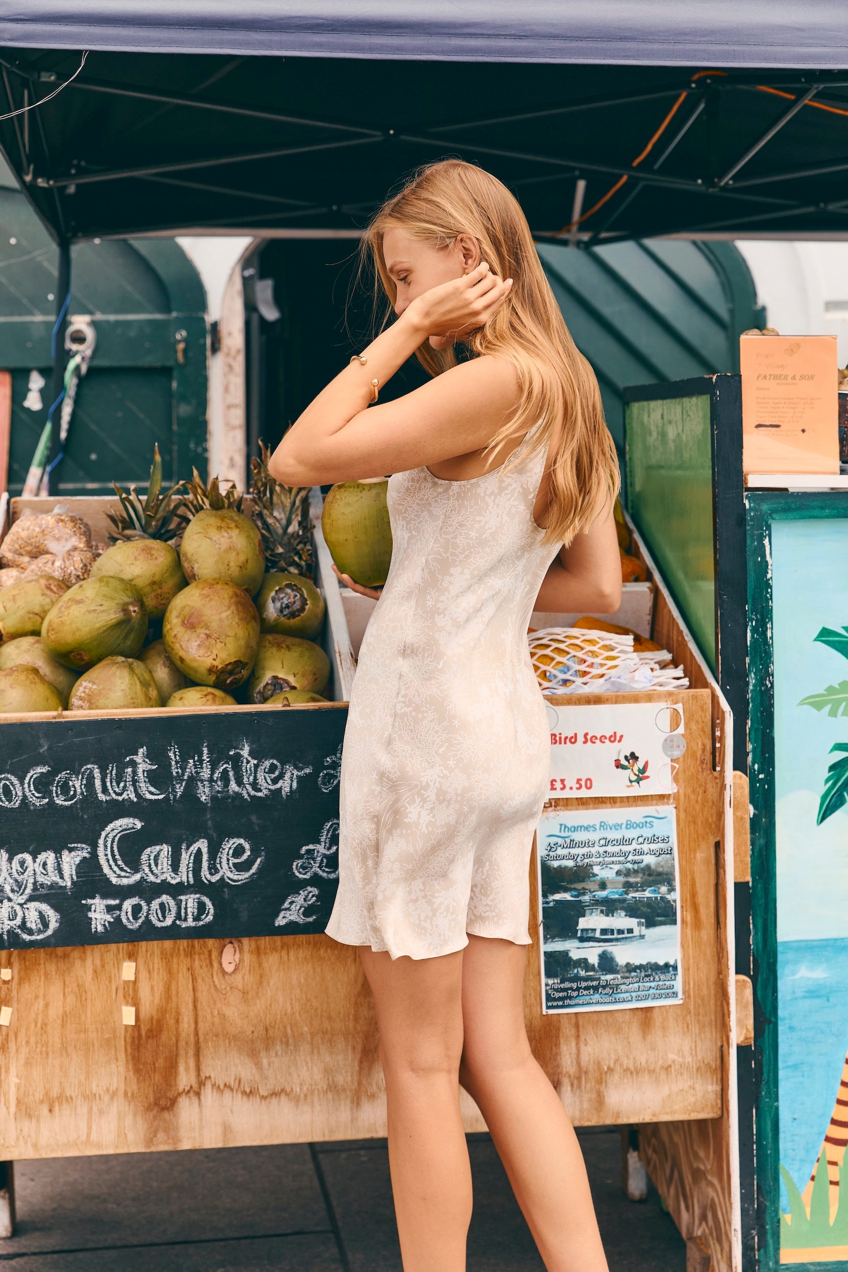 Woman in a mini slip dress on a tropical holiday