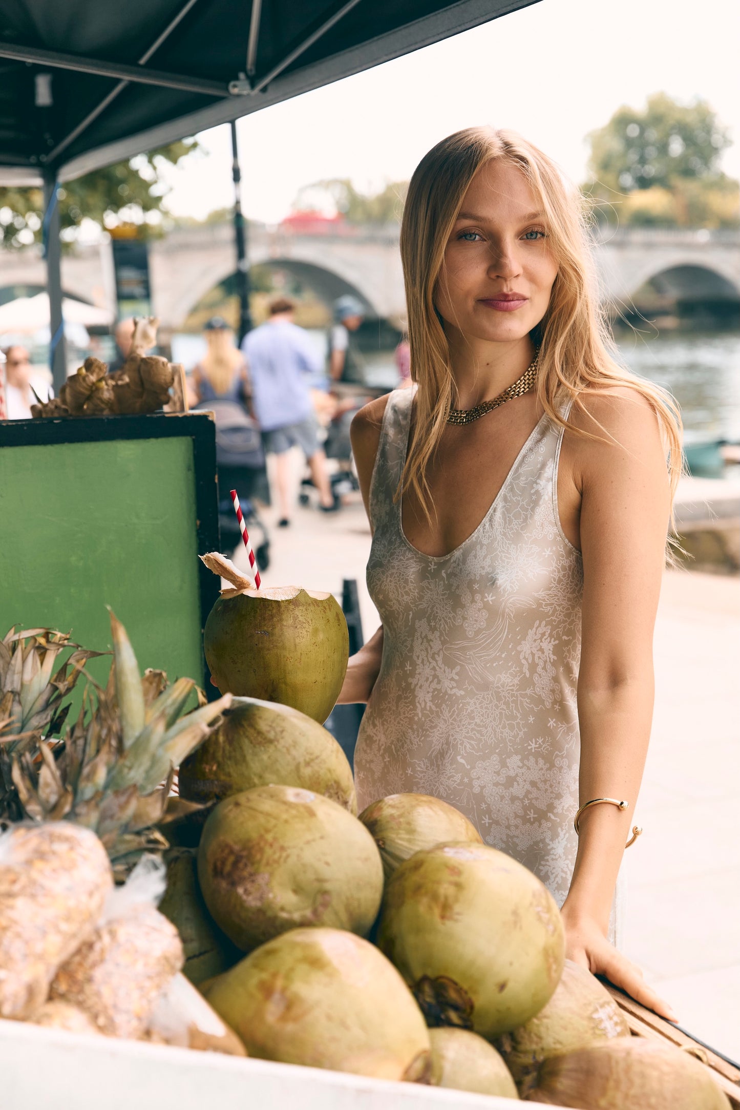 Woman wearing mini silk slip dress on holiday